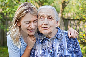 Woman embracing grandma
