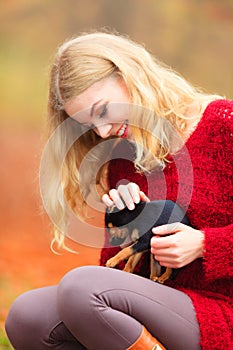 Woman embrancing her puppy dog