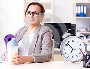 Woman employee going to sports from work during lunch break