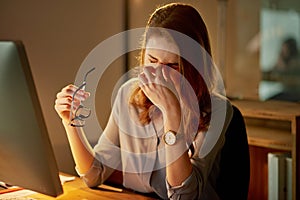 Woman, employee and tired in office with computer at work with overtime or deadline at night. Female person, exhausted