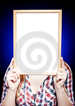 Woman with empty frame, copyspace
