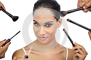 woman encircled by make up brushes
