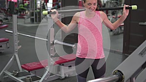 A woman is engaged in the gym.