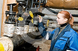 Woman engineer in a boiler room