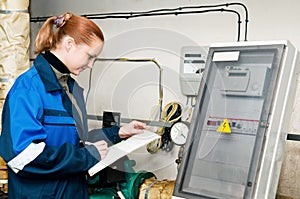 Woman engineer in a boiler room