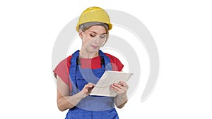 Woman engineer checking building plan on touchpad and looking at objects, buildings around her on white background.