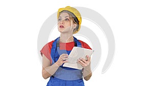 Woman engineer checking building plan on touchpad and looking at objects, buildings around her on white background.