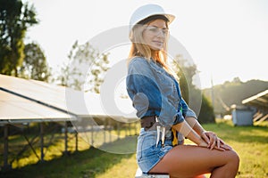 Woman engineer checking solar panels setup