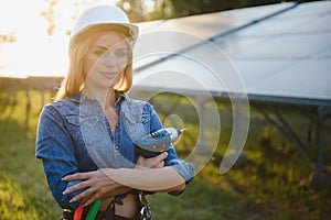 Woman engineer checking solar panels setup