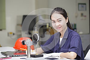 Woman engineer use vernier height gauge