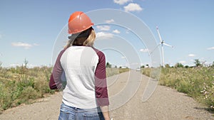 Woman engineer working in wind turbine electricity industrial