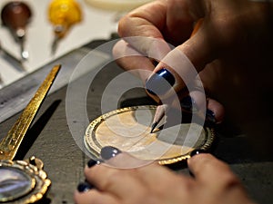 Woman engraver at work.