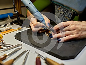 Woman engraver at work.