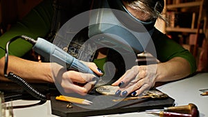 Woman engraver at work.