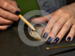 Woman engraver at work.