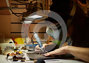 Woman engraver at work.