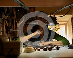 Woman engraver at work.