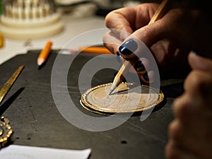 Woman engraver at work.