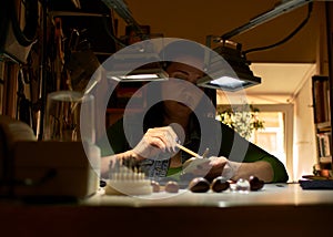 Woman engraver at work.