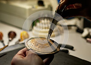 Woman engraver at work.