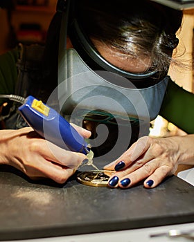 Woman engraver at work.