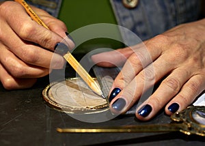 Woman engraver at work.