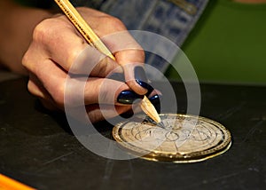 Woman engraver at work.