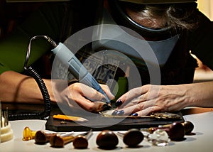 Woman engraver at work.