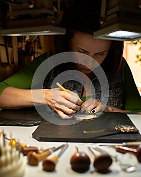 Woman engraver at work.