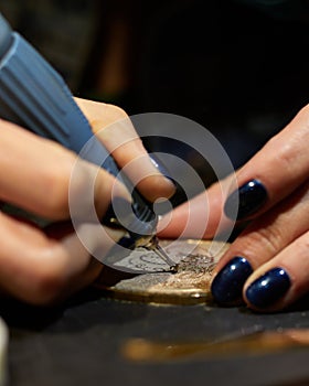 Woman engraver at work.