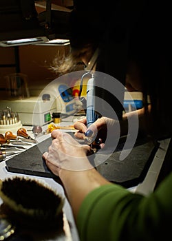 Woman engraver at work.