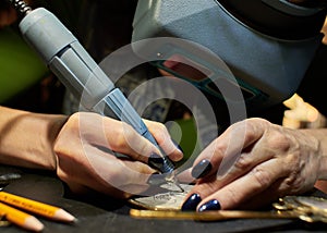 Woman engraver at work.