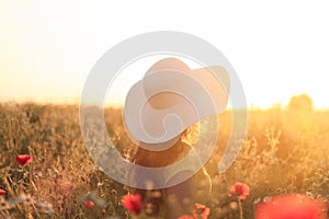 Woman enjoing sunset view on the meadow photo