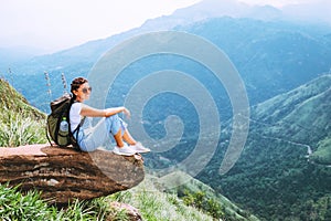 Woman enjoy with beautiful view on mountains and valley in Ella, Sri Lanka, Little Adam Peak