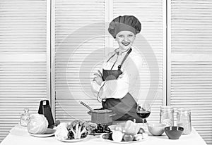 Woman enjoy cooking food. Housekeeping and culinary. Housewife prepare meal with wine. Housewife daily routine. Girl