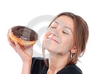 Woman enjoy donut. Unhealthy junk food concept