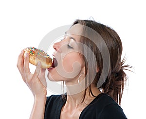 Woman enjoy donut. Unhealthy junk food concept