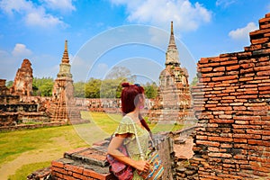 woman enjoy her visit temple at Ayutthaya