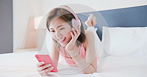 Woman enjoy music by smartphone