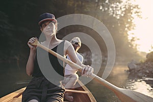 Woman enjoy paddling canoe