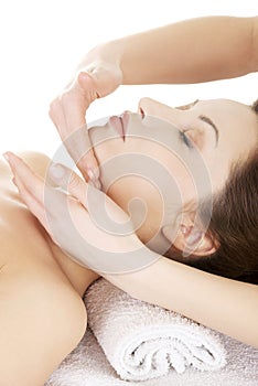 Woman enjoy receiving face massage