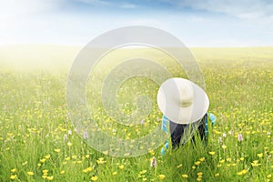 Woman enjoy springtime on meadow