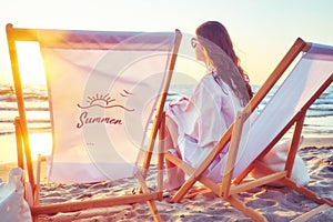 Woman enjoy summer sunset on the beach