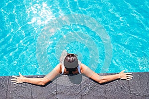 Woman enjoy the sun in swimming pool