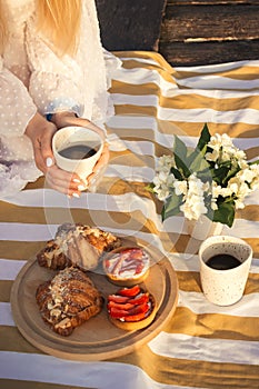 Woman enjoy tasty coffee on picnic outdoors