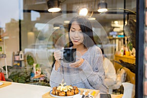 Woman enjoy tea time in coffee shop