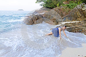 Woman enjoy with wave in morning on Lonely Beach