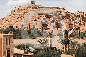 Woman enjoying Ait-Ben-Haddou. View from behind. Travel in Morocco, Ouarzazate