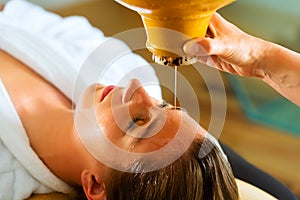 Woman enjoying a Ayurveda oil massage