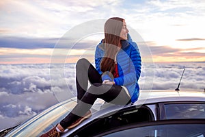 Woman enjoying beautiful cloudscape